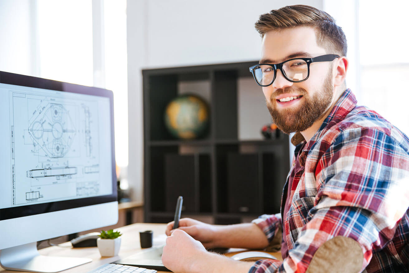 engineer engineer at computer smiling