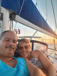 Hany & his wife enjoying a sunset sail on their sailboat.